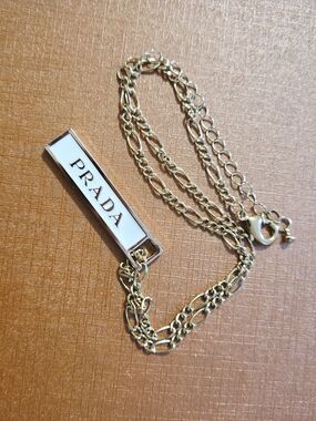 Prada Gold Multi-Chain Necklace with White Logo Bar